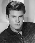 The Travelin' Man video was originally pieced together by Ozzie Nelson as a way to get more exposure for Ricky on the family show. The song became a #1 for Ricky Nelson in 1961 and is considered by many to be the very first music video.