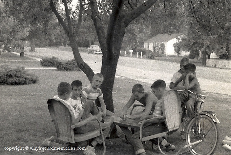 A hot Saturday afternoon with friends on St. Claire ave near Furhman's grocery in the Lindenwald area Hamilton, Ohio...crica, late fifties.