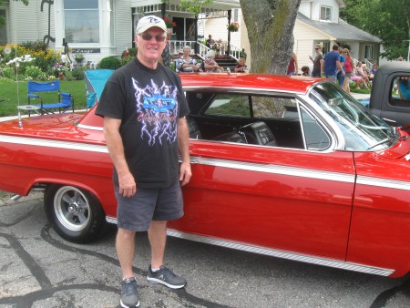 Owner Tim Pearcy with his Roman Red 1962 Chevy.